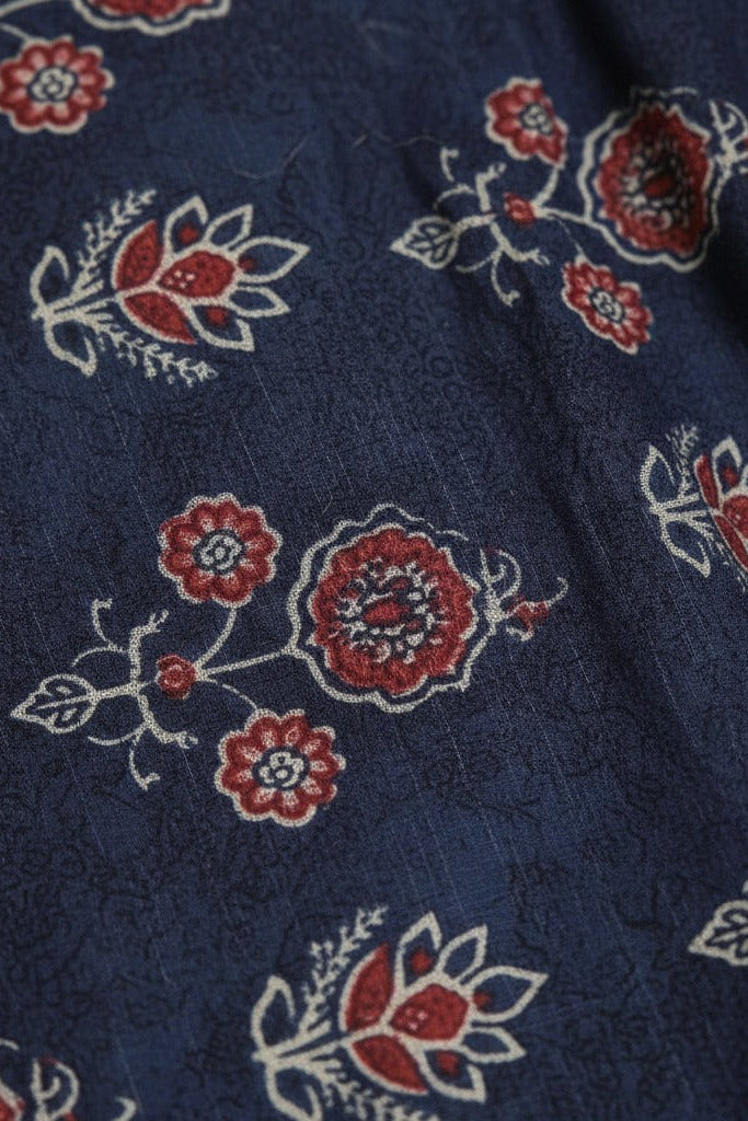 Navy blue fabric with red and white floral patterns