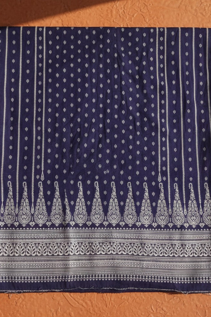 Navy blue fabric with white patterns on an orange background