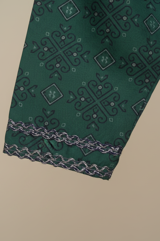 Green patterned fabric with decorative border on a beige background